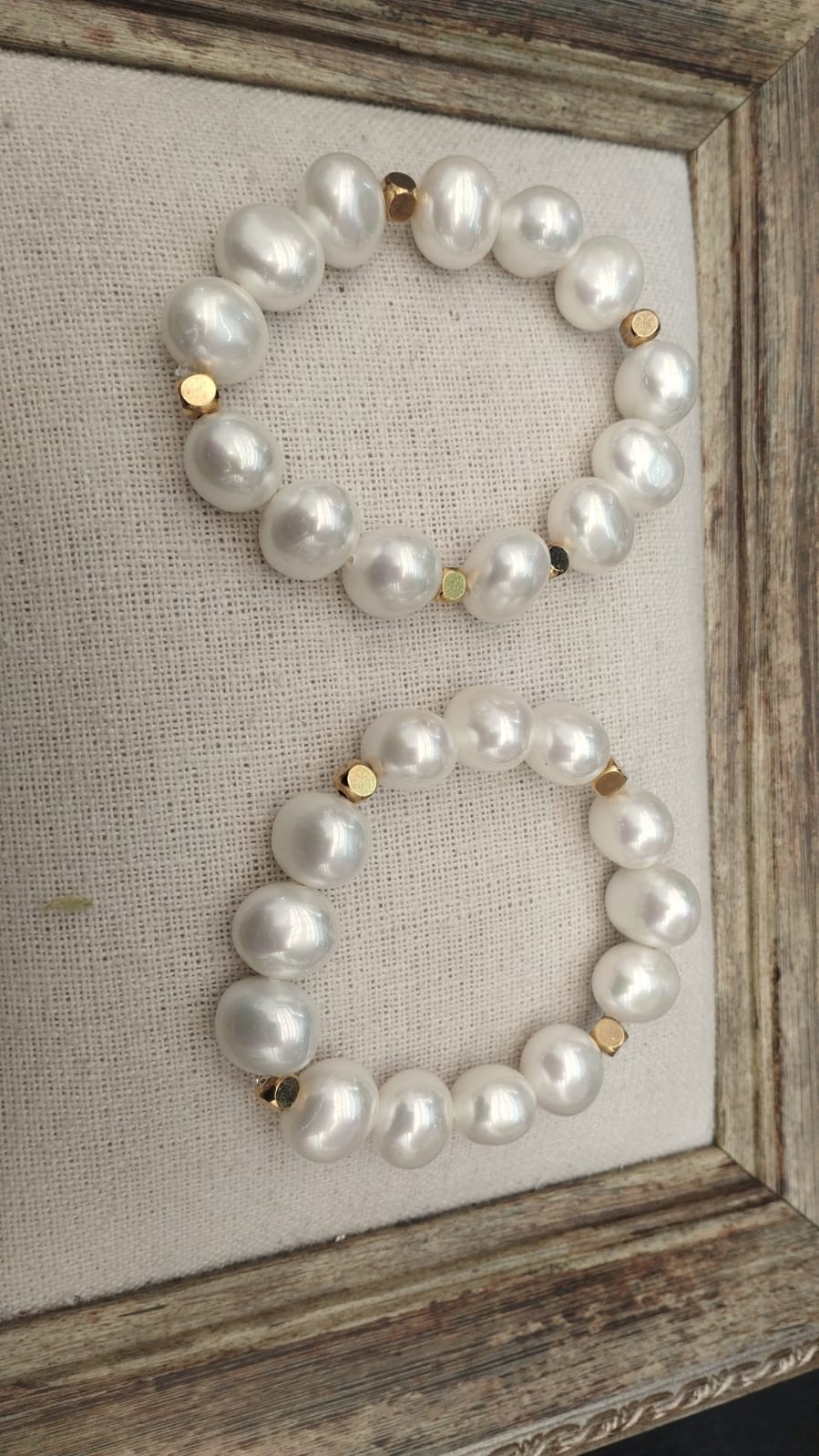 Pearl bracelet on fabric
